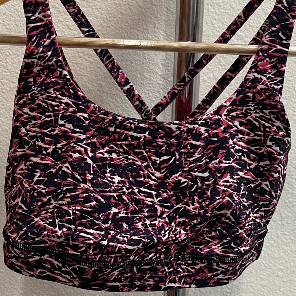 Lululemon sports bra, pink - purple - black, with pink lining. Size 6.